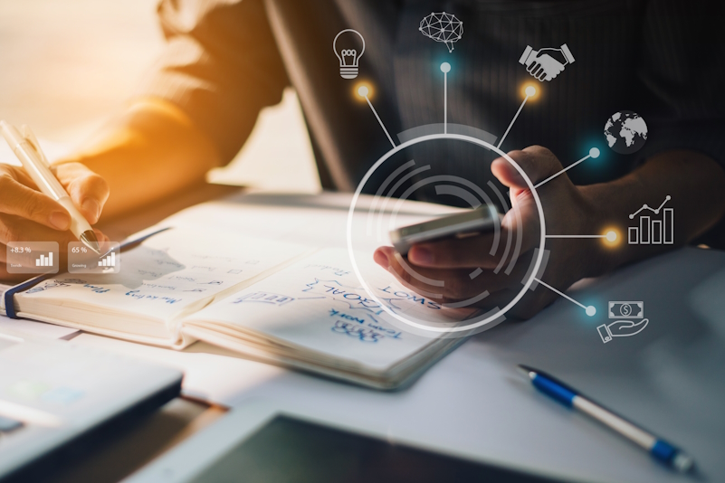 businessman-analyzing-company-financial-report-with-augmented-reality-graphics